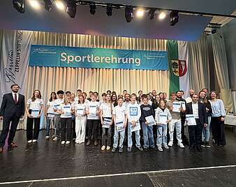 Ein Gruppenfoto auf der Bühne