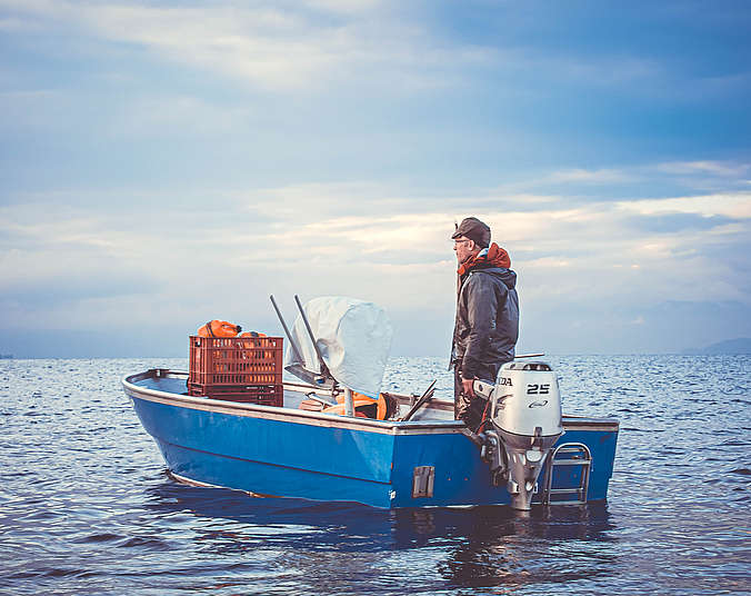Fischer in Boot auf dem Bodensee
